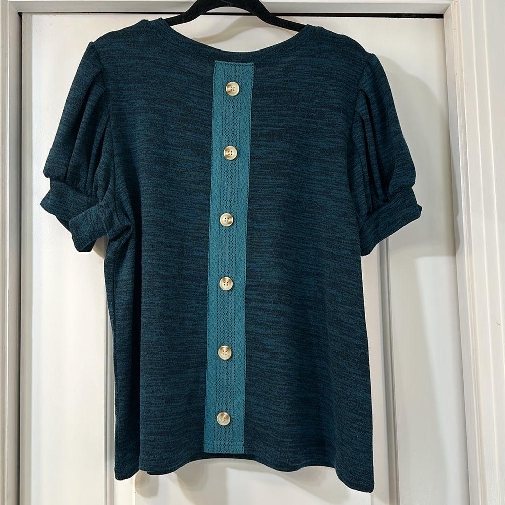 Amaryllis XL teal knit top with lace detail on the back.